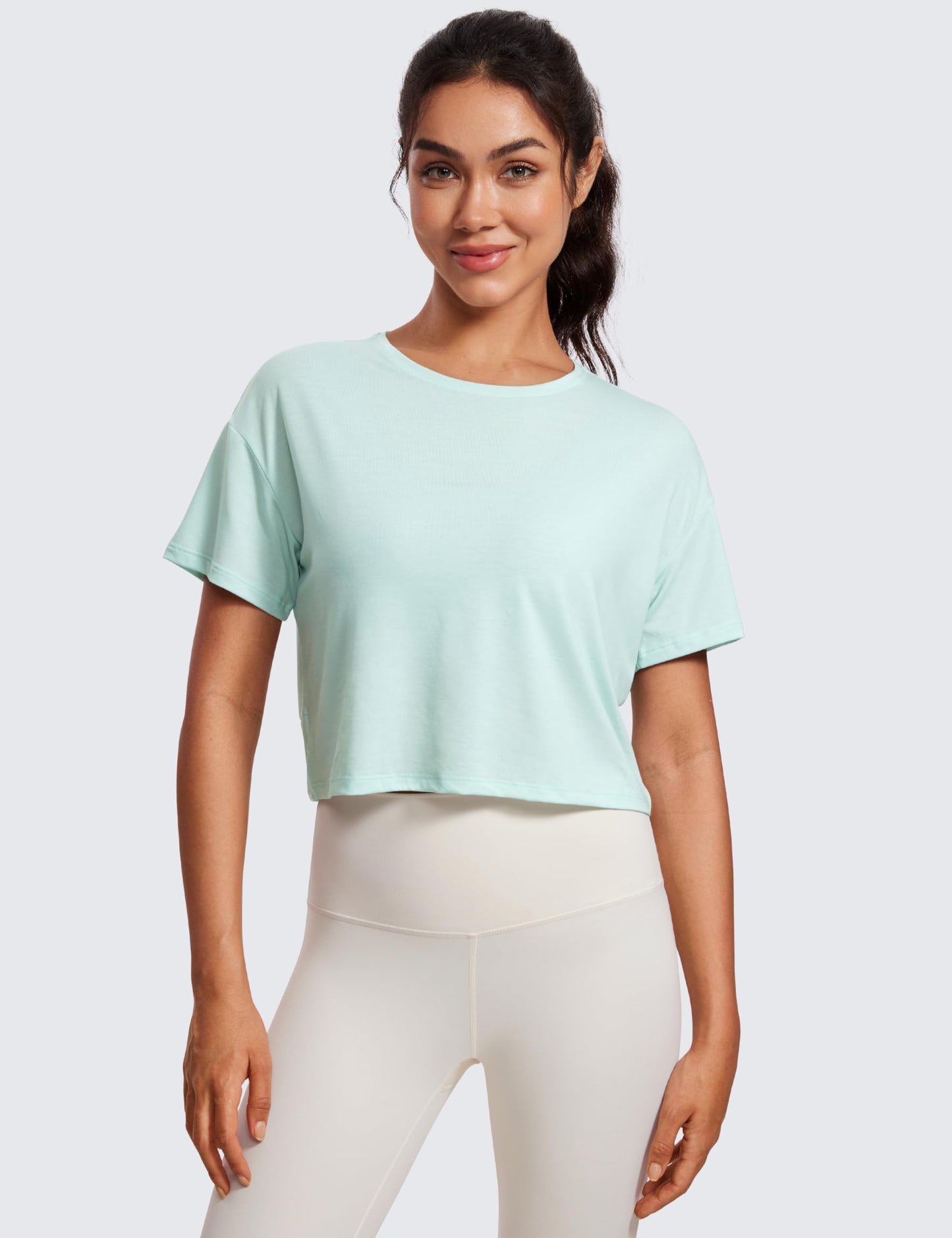 CRZ YOGA Open Back Short Sleeve Crop Top for Women Loose Athletic Yoga Workout Tops Casual Cropped Tee Shirts Skylight Green Small